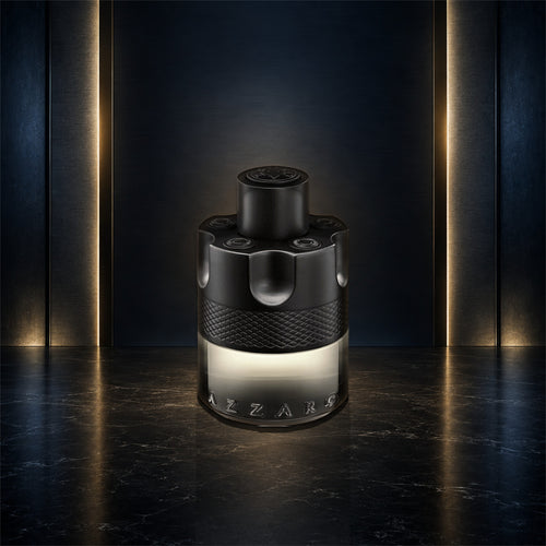 Azzaro The Most Wanted Eau de Toilette Intense 3.4 oz bottle on a navy, gunmetal, and gold studio background